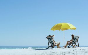 Yellow beach umbrella an 2 people